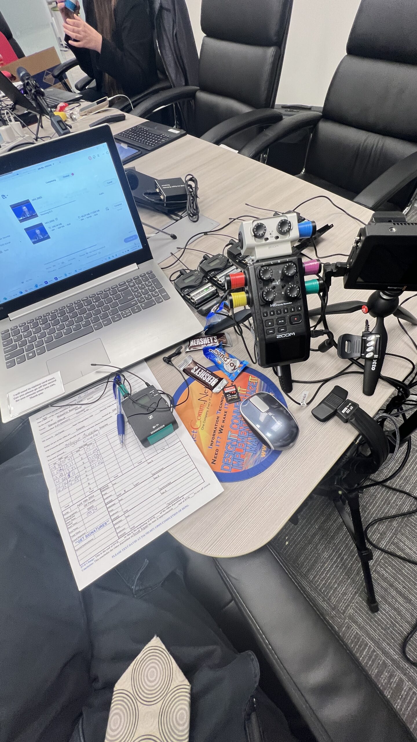 Videography Gear organized on conference table