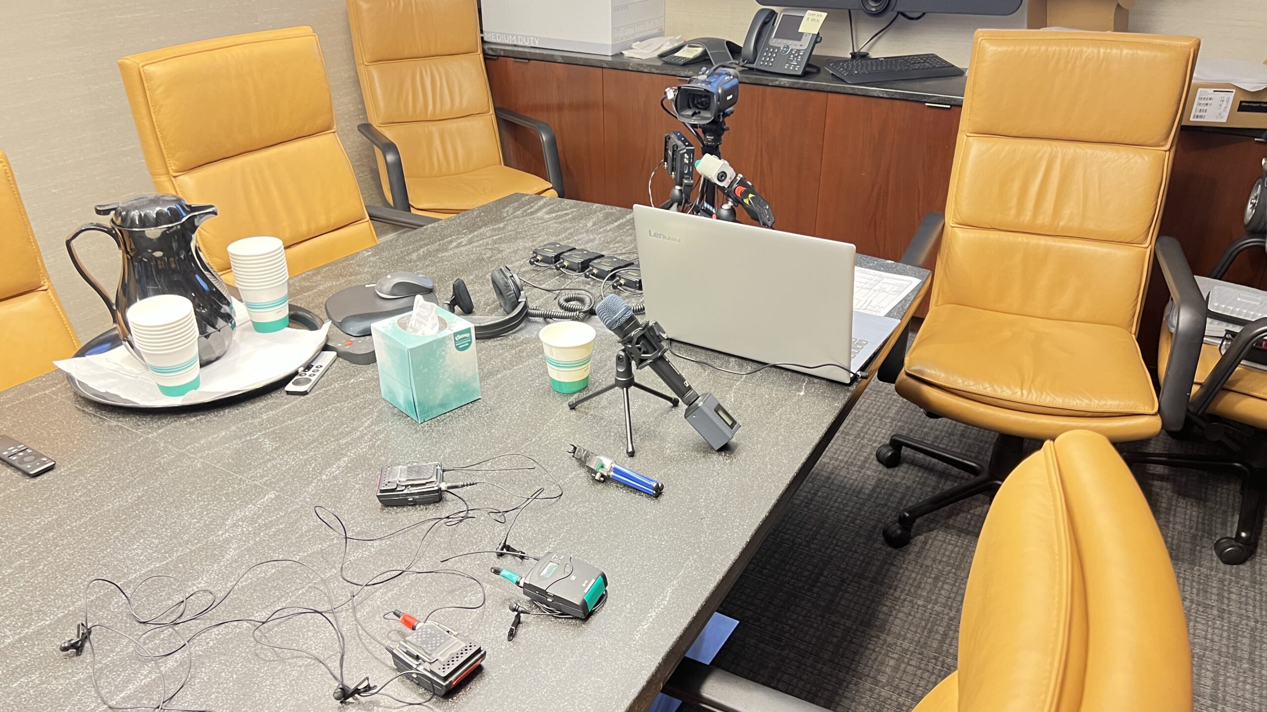 Deposition recording gear in use on conference room table