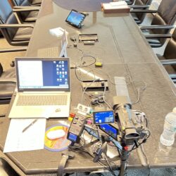 Deposition recording gear in use on conference room table